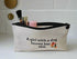 Cosmetic bag with text 'A girl with a dog knows her shit' on a white background