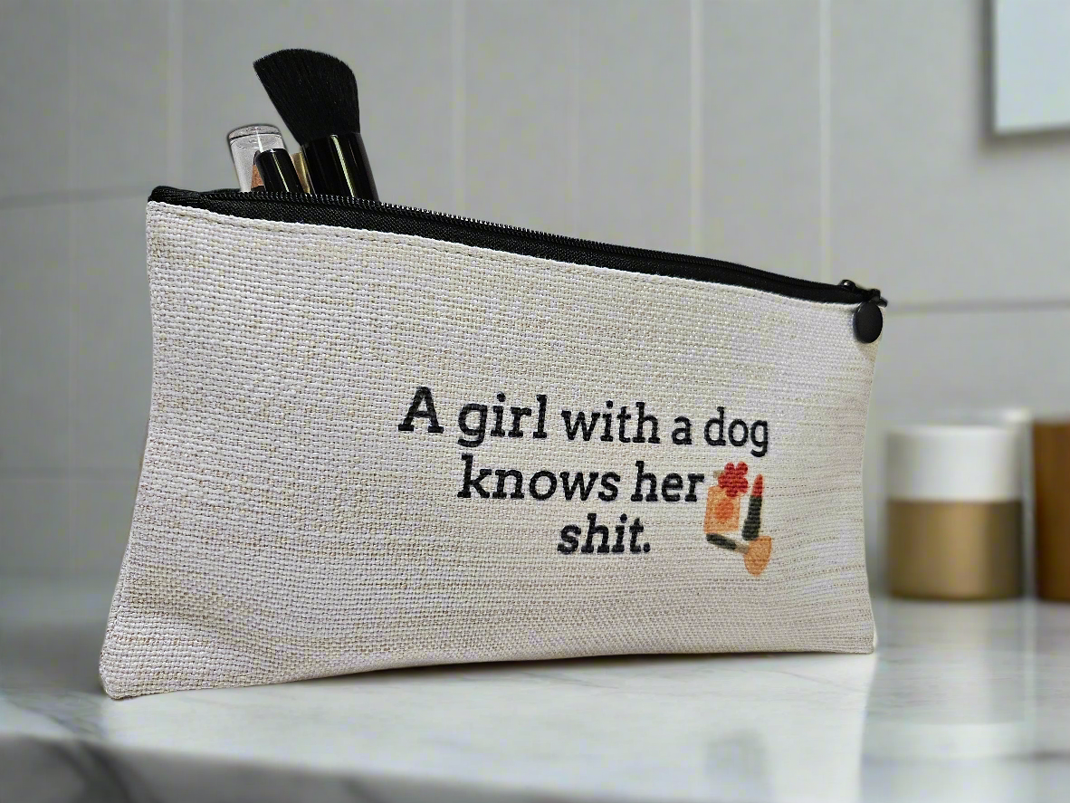 Textile pouch with humorous quote and dog illustration on a surface.