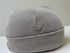 Gray knit beanie on a mannequin head against a white background