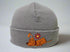 Gray knit beanie with a cartoon dog and flower design on a mannequin head against a white background